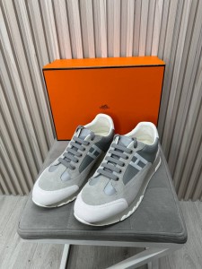 Кожаные кроссовки со вставками из натуральной замши Hermes Кожаные кроссовки со вставками из натуральной замши Hermes